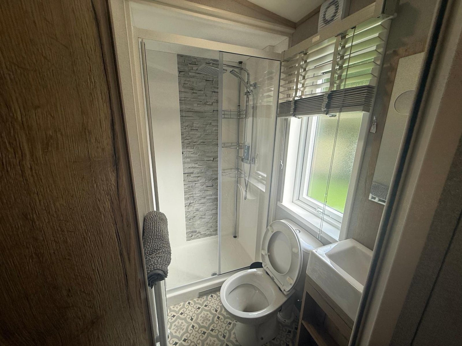 The shower room: walk-in cubicle and toilet